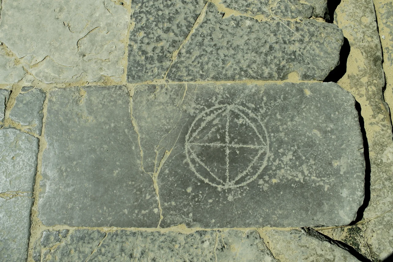 Roman board game engraved in the ground at the entrance of the amphitheatre in Italica (Seville, Spain).