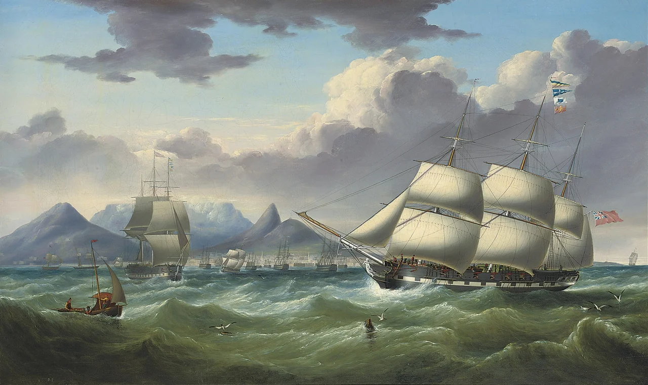 The merchantman Duke of Lancaster flying her recognition flags as she arrives in Table Bay, Cape Town, with another merchantman Royal Saxon outward-bound off her starboard bow