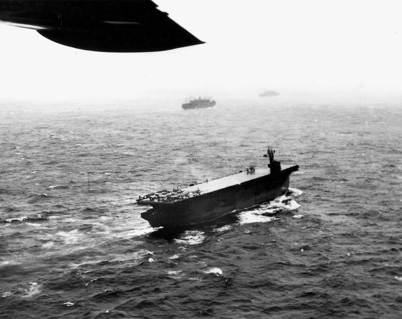 The U.S. Navy escort carrier USS Nassau (ACV-16) underway with a number of Grumman F4F-4 Wildcats of Composite Squadron 21 (VC-21) on her forward flight deck, in preparation for the invasion of Attu Island, in May 1943. Nassau was redesignated CVE-16 on 15 July 1943.